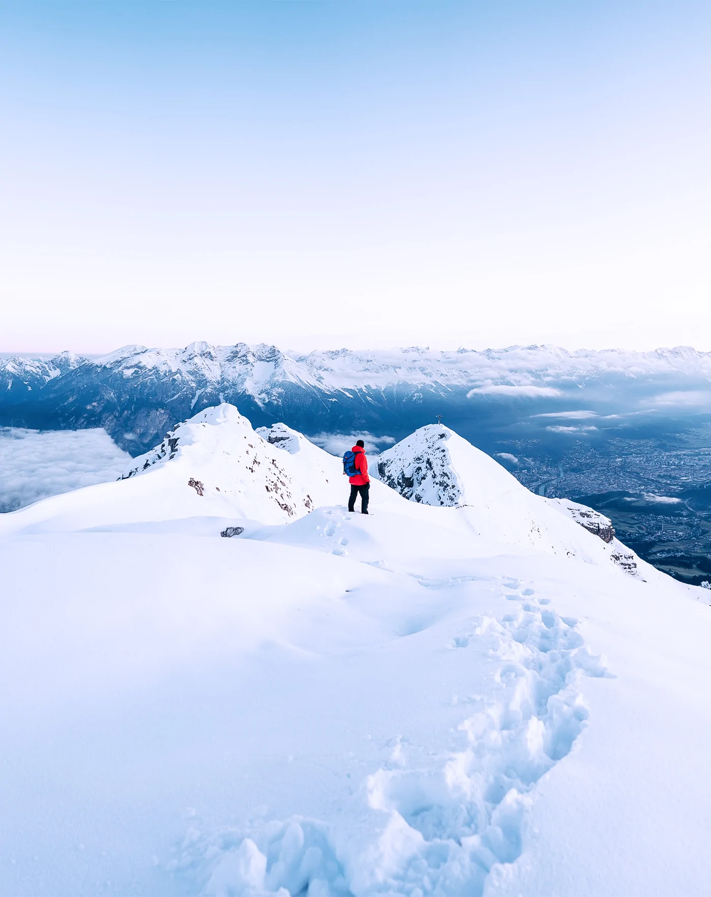 Man on top of snowy mountain